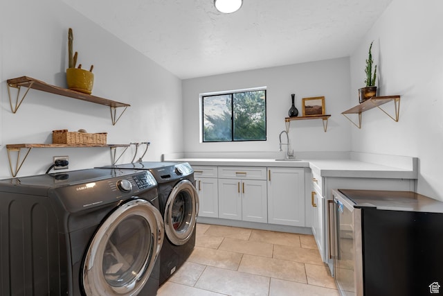 837 E 930 N, Pleasant Grove, UT 84062 - laundry area featuring washing machine and dryer, sink, light tile patterned floors, and cabinets