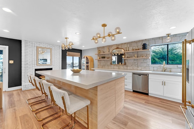 837 E 930 N, Pleasant Grove, UT 84062 - kitchen featuring white cabinets, decorative light fixtures, stainless steel appliances, and plenty of natural light