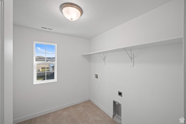 laundry area featuring electric dryer hookup and washer hookup