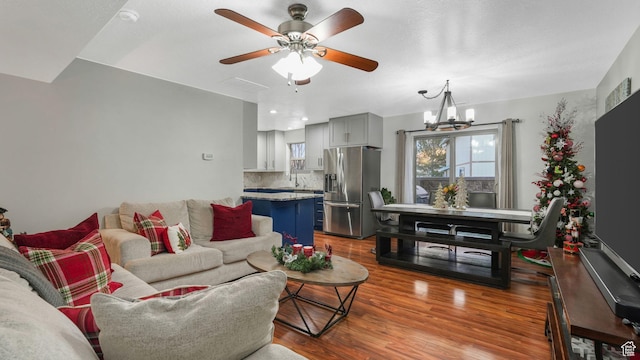 822 N 1120 E, Spanish Fork, UT 84660 - living area featuring wood finished floors, a ceiling fan, and a chandelier