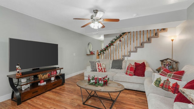 living room with ceiling fan and hardwood / wood-style floors
