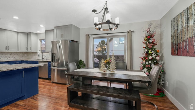822 N 1120 E, Spanish Fork, UT 84660 - dining room featuring healthy amount of natural light, a chandelier, wood finished floors, and recessed lighting