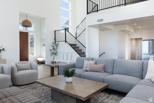 470 Lotus Dr Unit 149, Fish Haven, ID 83287 - living area featuring a high ceiling, wood finished floors, and stairs