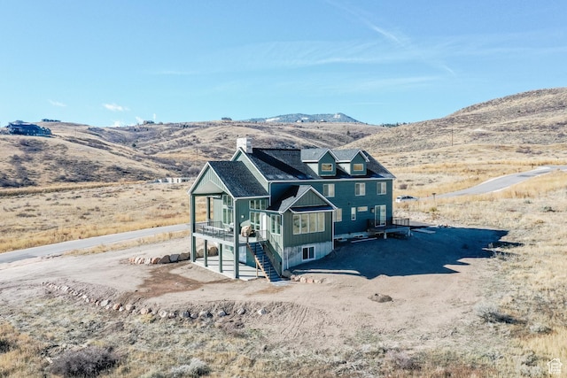470 Lotus Dr Unit 149, Fish Haven, ID 83287 - view of front facade featuring a chimney and a deck with mountain view