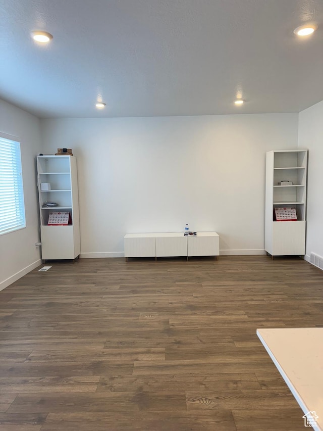 unfurnished room featuring dark hardwood / wood-style floors