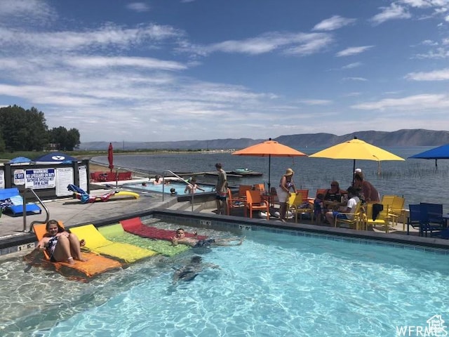 55 W Buttercup Ln Unit 33, Garden City, UT 84028 - view of swimming pool with a water and mountain view