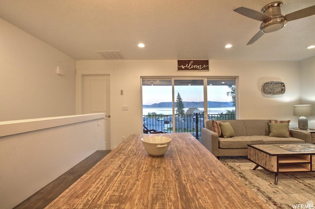 55 W Buttercup Ln Unit 33, Garden City, UT 84028 - dining area with ceiling fan, a water view, and hardwood / wood-style flooring