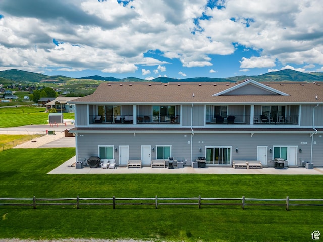 55 W Buttercup Ln Unit 33, Garden City, UT 84028 - rear view of house featuring a mountain view, a patio, and a balcony