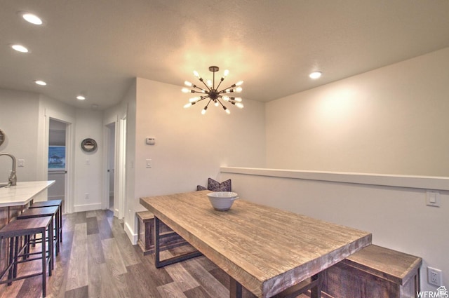 55 W Buttercup Ln Unit 33, Garden City, UT 84028 - dining space with a notable chandelier, dark hardwood / wood-style flooring, and sink