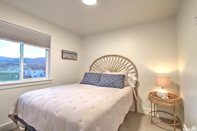 55 W Buttercup Ln Unit 33, Garden City, UT 84028 - bedroom featuring a mountain view and carpet floors
