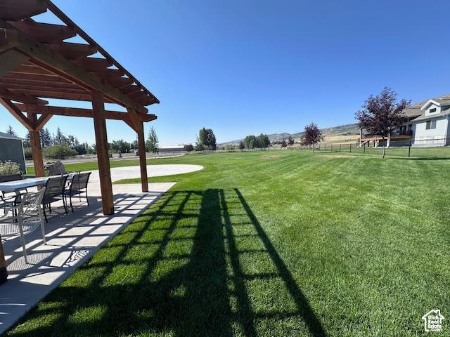 55 W Buttercup Ln Unit 33, Garden City, UT 84028 - view of yard featuring a pergola and a patio area