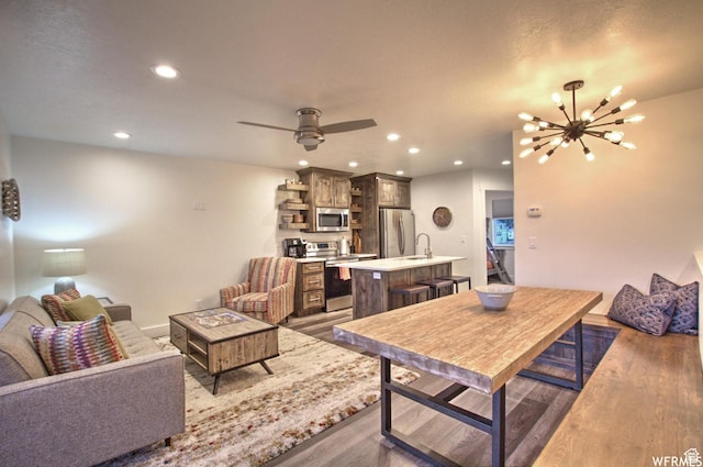 55 W Buttercup Ln Unit 33, Garden City, UT 84028 - living room with ceiling fan with notable chandelier, dark hardwood / wood-style floors, and sink