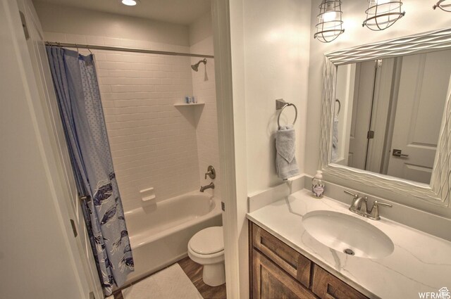 55 W Buttercup Ln Unit 33, Garden City, UT 84028 - full bathroom with vanity, toilet, wood-type flooring, and shower / tub combo