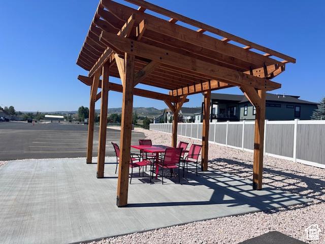 55 W Buttercup Ln Unit 33, Garden City, UT 84028 - view of patio / terrace with a pergola