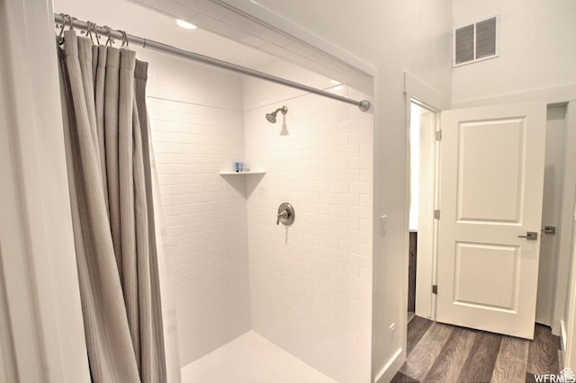 55 W Buttercup Ln Unit 33, Garden City, UT 84028 - bathroom with hardwood / wood-style floors and curtained shower