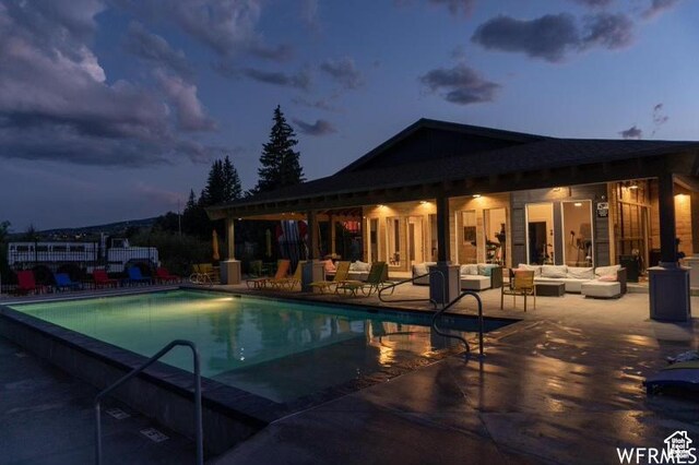 55 W Buttercup Ln Unit 33, Garden City, UT 84028 - pool at dusk with an outdoor hangout area and a patio area