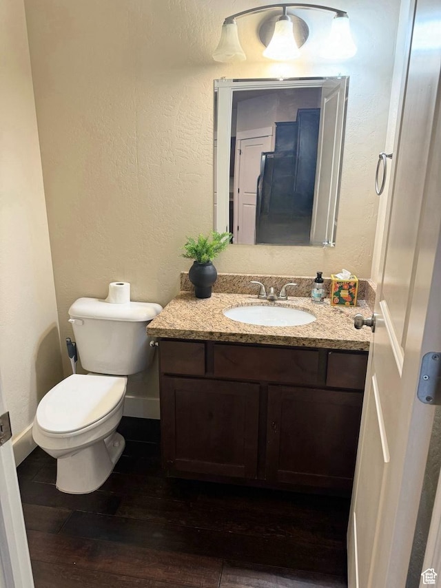 1024 W 700 S, Pleasant Grove, UT 84062 - bathroom with hardwood / wood-style flooring, vanity, and toilet
