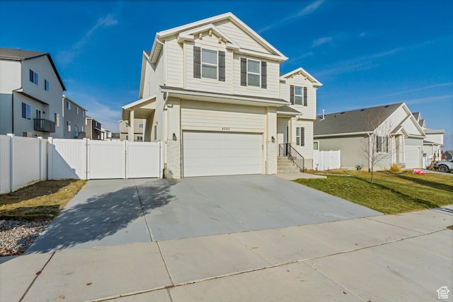 view of front of house featuring a garage and a front yard