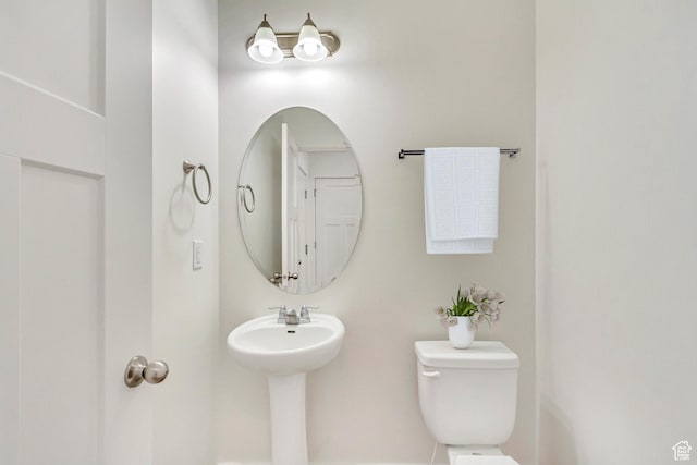 bathroom featuring toilet