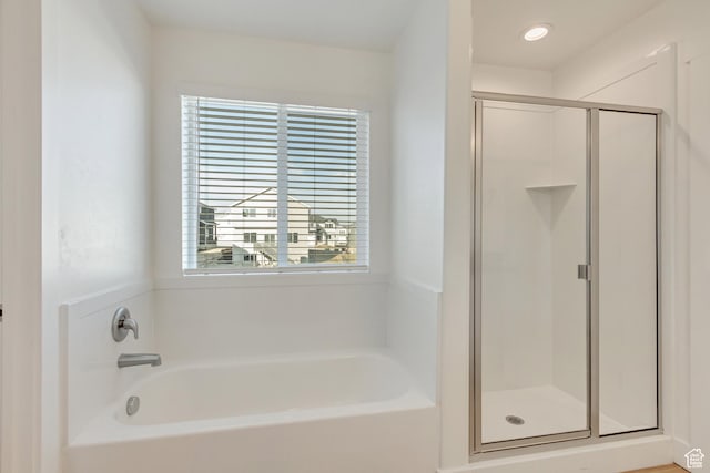 bathroom featuring plus walk in shower