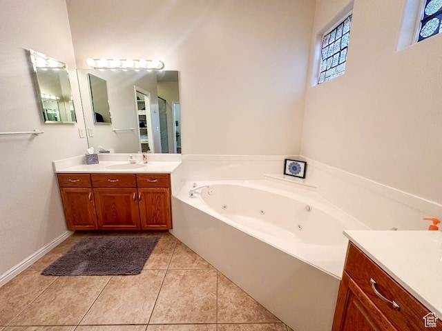 715 Lobo Ln, Washington, UT 84780 - bathroom featuring tile patterned flooring, a washtub, and vanity