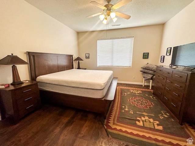 715 Lobo Ln, Washington, UT 84780 - bedroom featuring a textured ceiling, ceiling fan, and dark hardwood / wood-style floors