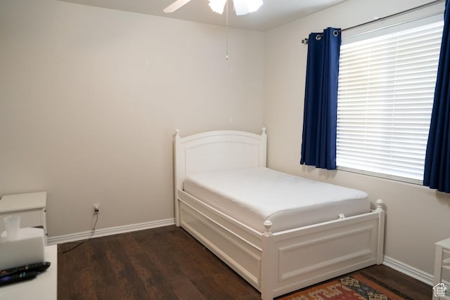 715 Lobo Ln, Washington, UT 84780 - bedroom featuring multiple windows, ceiling fan, and dark wood-type flooring