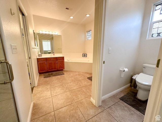 715 Lobo Ln, Washington, UT 84780 - full bathroom with tile patterned floors, vanity, toilet, and plus walk in shower