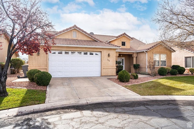 view of front of property featuring a garage and a front lawn