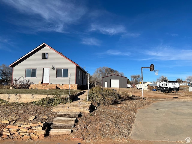 view of home's exterior with an outbuilding and a garage