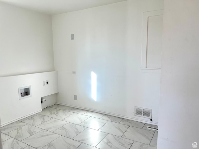 washroom with electric dryer hookup and hookup for a washing machine