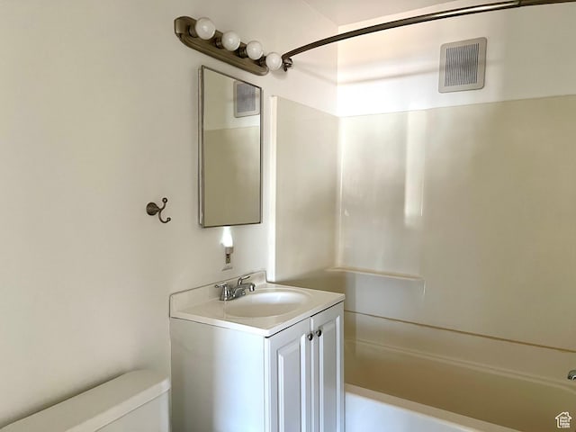 full bathroom featuring vanity, shower / bath combination, and toilet