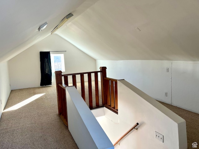 bonus room featuring light colored carpet and lofted ceiling
