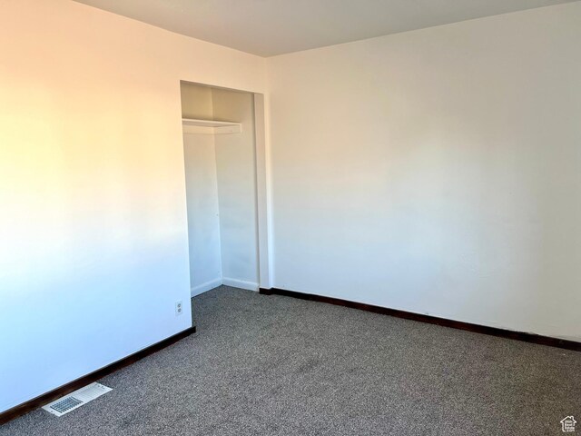 240 W 200 S, Blanding, UT 84511 - unfurnished bedroom featuring dark colored carpet and a closet