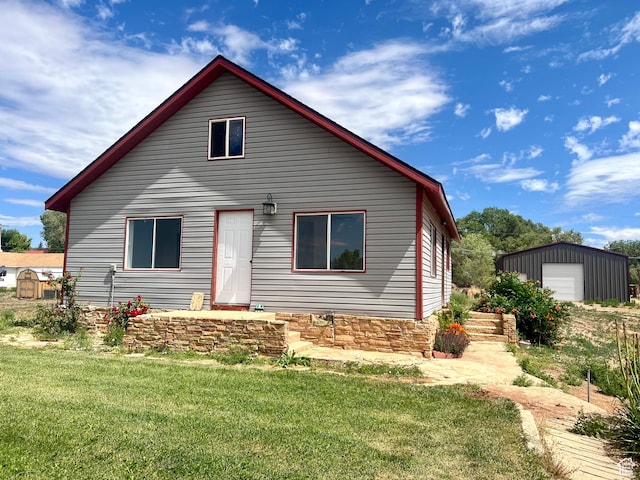 240 W 200 S, Blanding, UT 84511 - view of front facade featuring an outdoor structure, a front lawn, and a detached garage