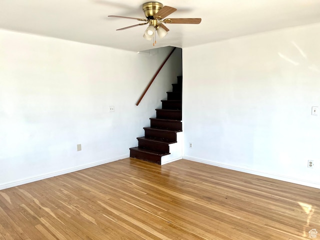 spare room with ceiling fan and light hardwood / wood-style floors