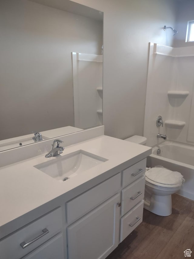 7497 W Sage Slope Way, Herriman, UT 84096 - full bath with vanity, toilet, wood finished floors, and  shower combination