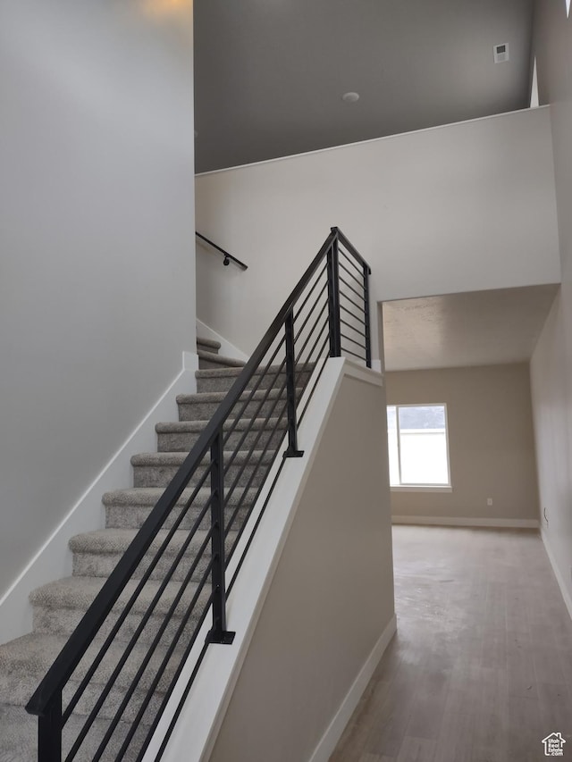 7497 W Sage Slope Way, Herriman, UT 84096 - stairway with baseboards and wood finished floors