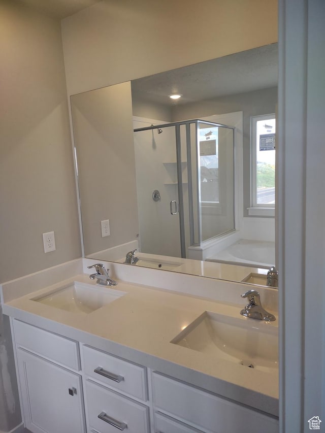 7497 W Sage Slope Way, Herriman, UT 84096 - full bath with a shower stall, double vanity, and a garden tub
