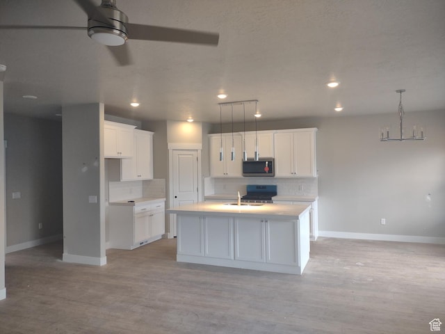 7497 W Sage Slope Way, Herriman, UT 84096 - kitchen with stainless steel appliances, baseboards, backsplash, and recessed lighting