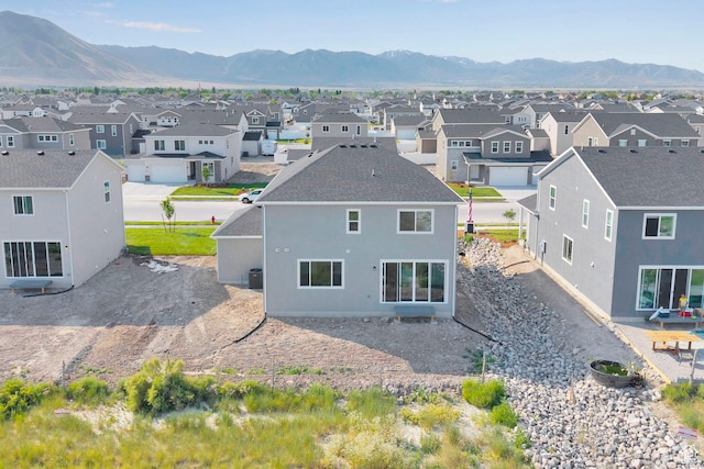 458 W Lefty Ln Unit 1129, Stansbury Park, UT 84074 - aerial perspective of suburban area featuring a mountainous background