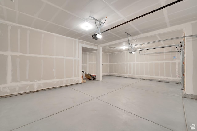 458 W Lefty Ln Unit 1129, Stansbury Park, UT 84074 - garage featuring a garage door opener