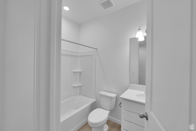 458 W Lefty Ln Unit 1129, Stansbury Park, UT 84074 - full bath with vanity, toilet, baseboards, shower / washtub combination, and wood finished floors