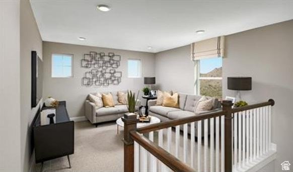 458 W Lefty Ln Unit 1129, Stansbury Park, UT 84074 - living room with light carpet and a wealth of natural light