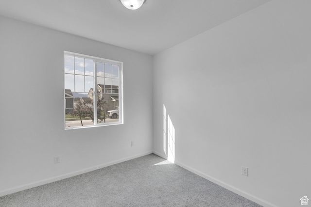 458 W Lefty Ln Unit 1129, Stansbury Park, UT 84074 - carpeted spare room with baseboards