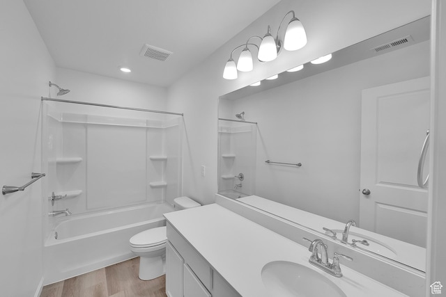 458 W Lefty Ln Unit 1129, Stansbury Park, UT 84074 - bathroom with toilet, vanity,  shower combination, wood finished floors, and recessed lighting