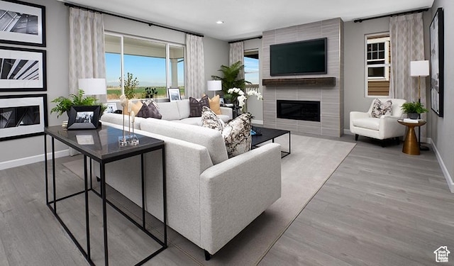 458 W Lefty Ln Unit 1129, Stansbury Park, UT 84074 - living room featuring a large fireplace and wood-type flooring