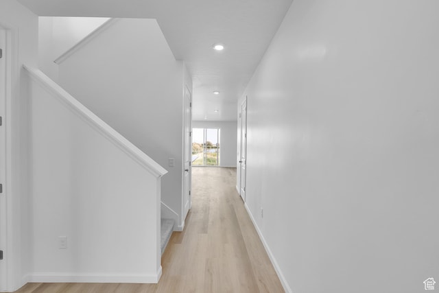 458 W Lefty Ln Unit 1129, Stansbury Park, UT 84074 - hall with light wood-style flooring, stairway, recessed lighting, and baseboards