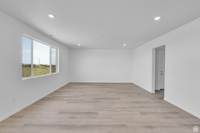 458 W Lefty Ln Unit 1129, Stansbury Park, UT 84074 - spare room with recessed lighting, light wood finished floors, and baseboards