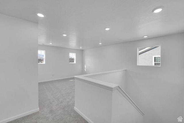 458 W Lefty Ln Unit 1129, Stansbury Park, UT 84074 - hall with recessed lighting, light colored carpet, baseboards, and an upstairs landing